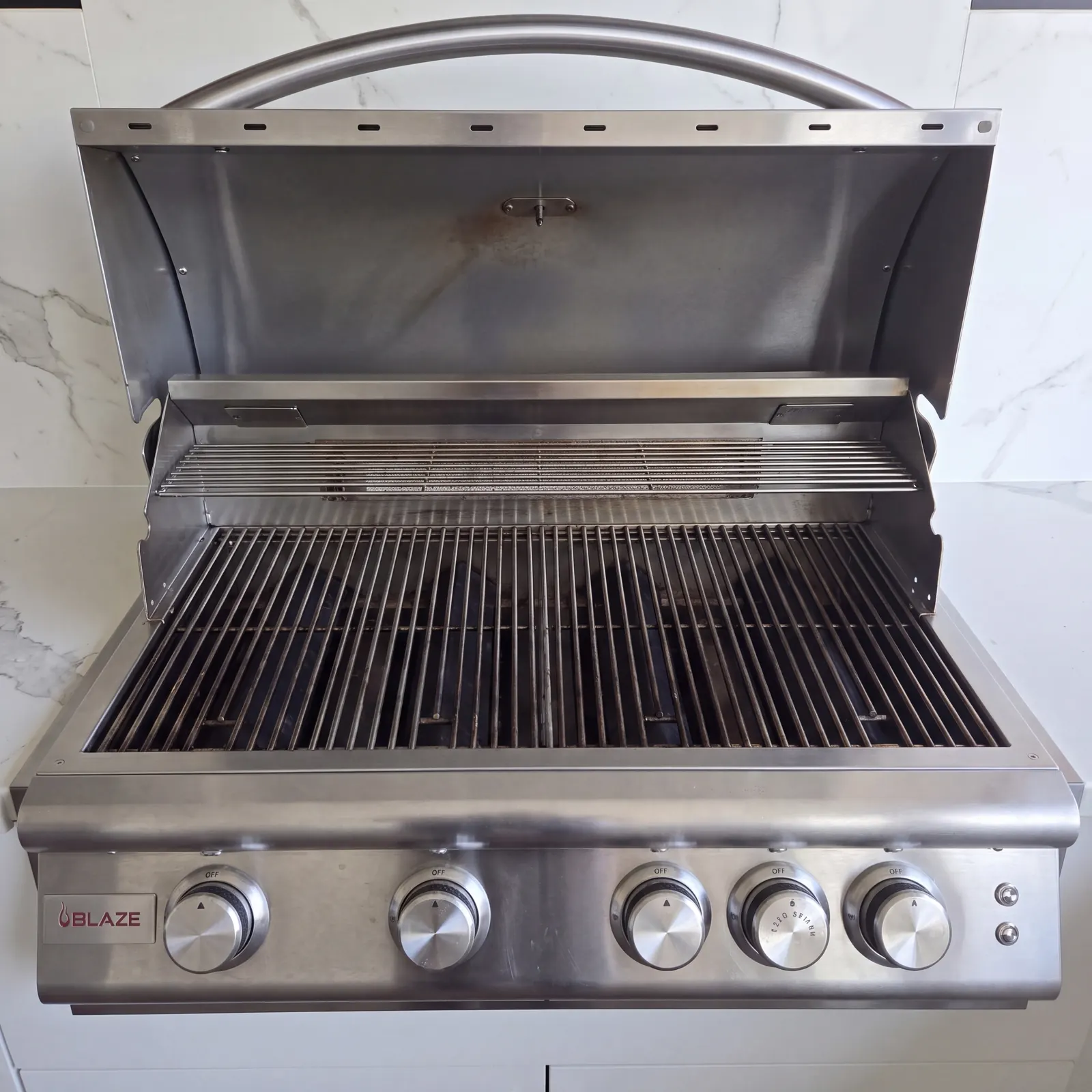The same built-in Blaze grill before and after the Deep Clean